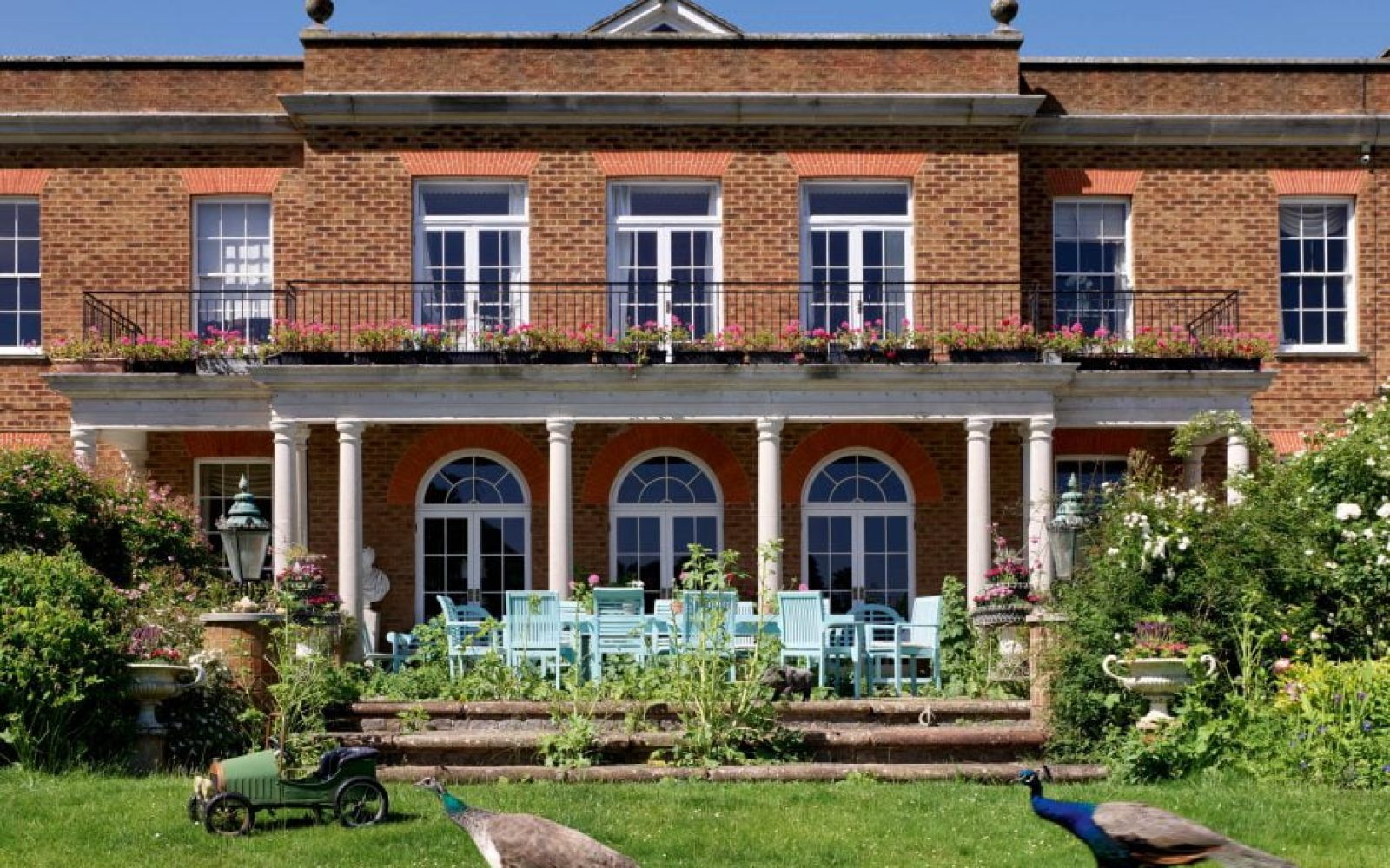 The south front of the house, outwardly a red-brick Georgian box of classic form. Fawley Hill, Buckinghamshire. ©Paul Highnam for Country Life